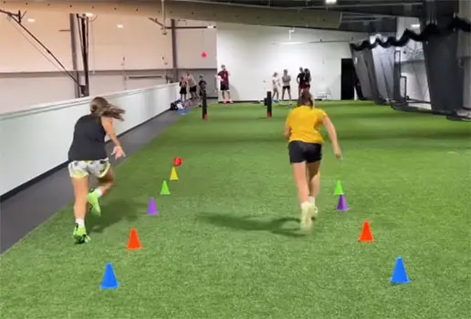 Athletes running on turf mezzanine